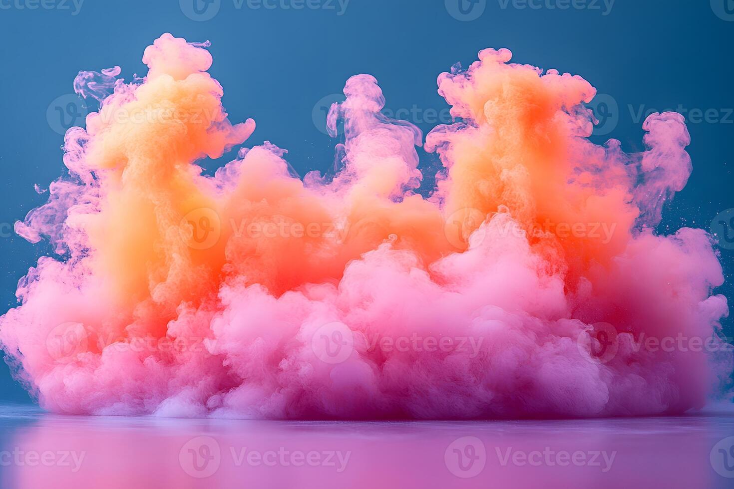 Vivid Color Explosion of Pink and Orange Paint Clouds on Blue Background for Creative Design photo