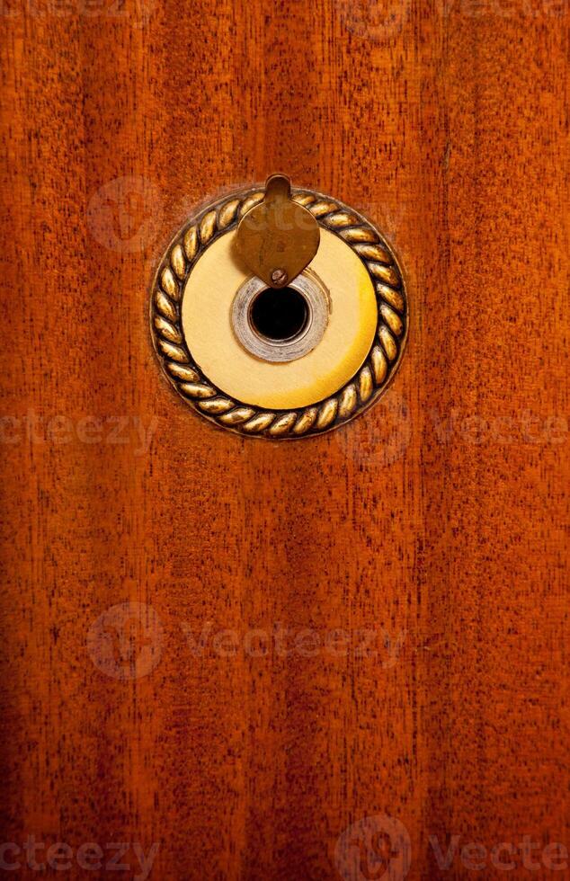 a wooden door with a hole in it photo