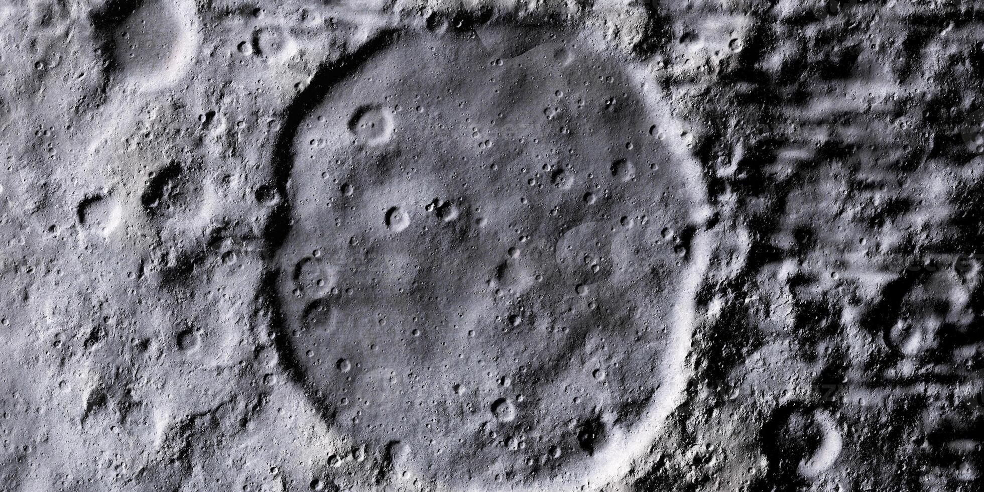 Aerial view of lunar crater landscape under harsh shadows creating a stunning contrast photo