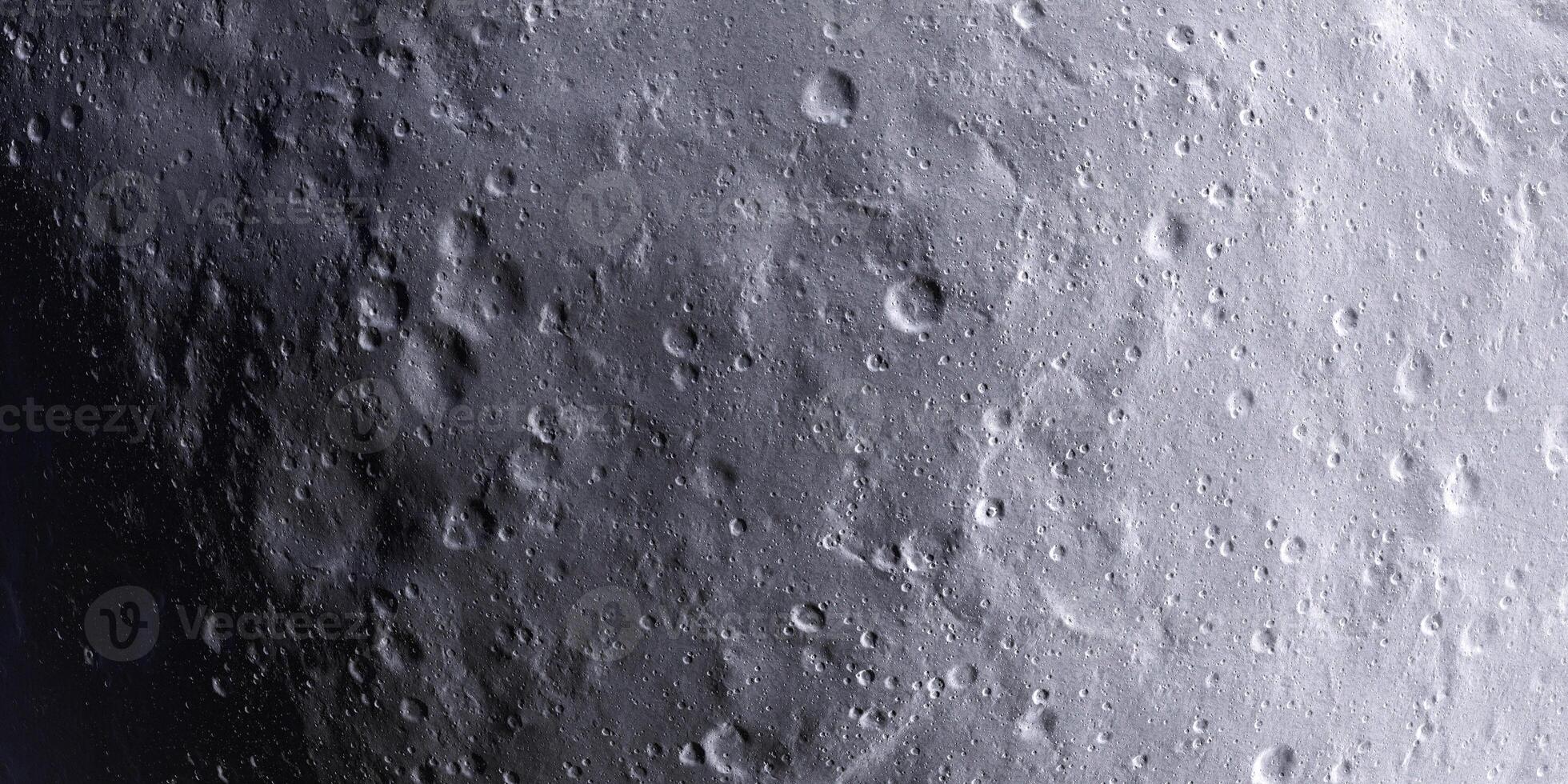 Detailed lunar surface with craters and shadows captured in monochrome view photo