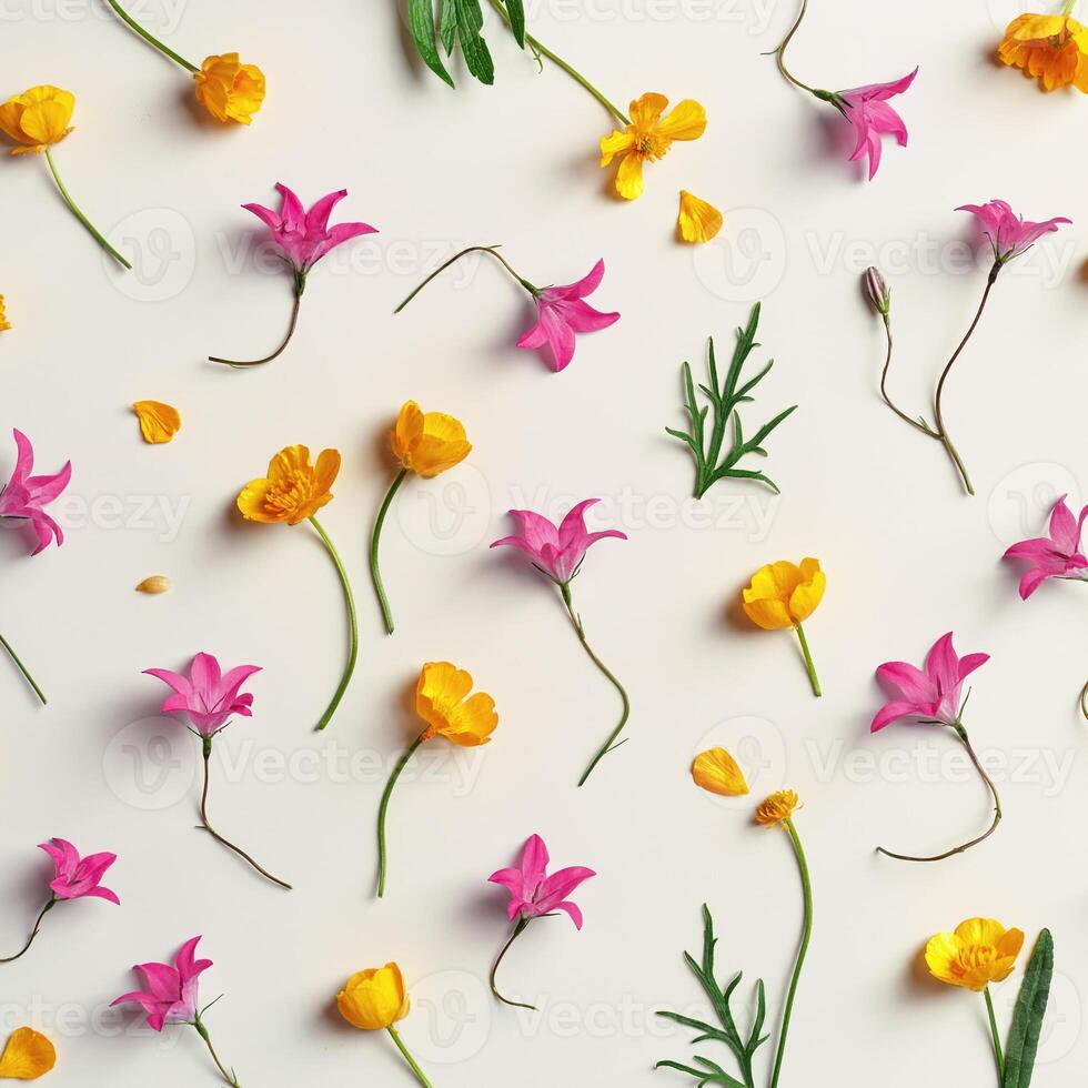 Minimal floral pattern of field flowers, top view Yellow purple flower, green leaf on beige background, spring summer season concept, creative flat lay beauty nature, wild blooms, florals design photo