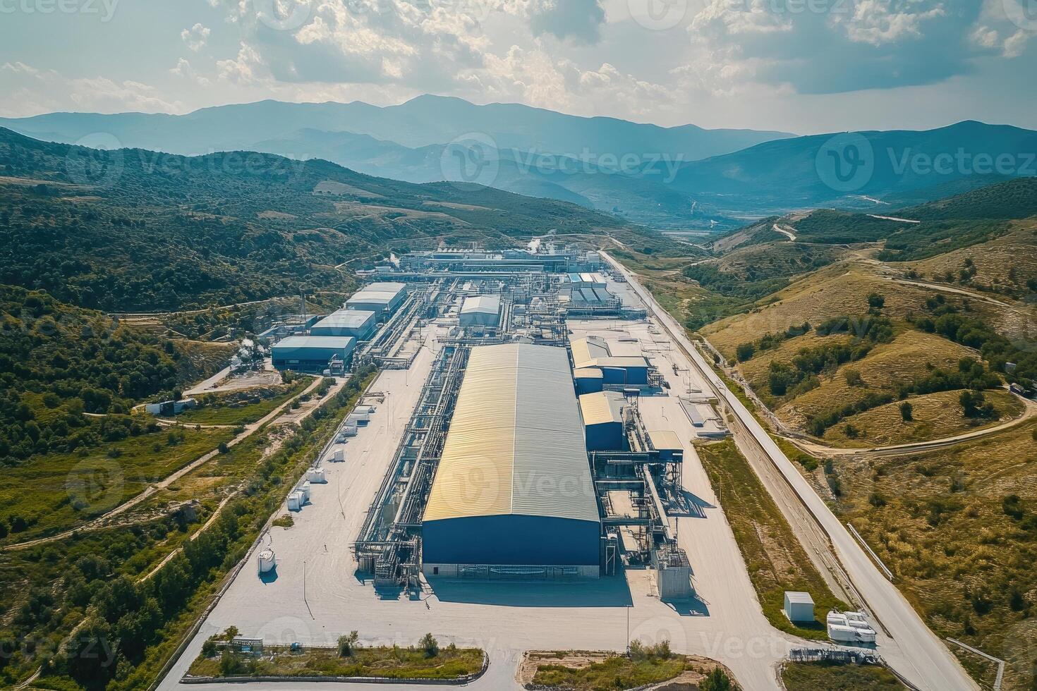 Lithium processing plant stands in a valley surrounded by hills, promoting sustainable energy production photo
