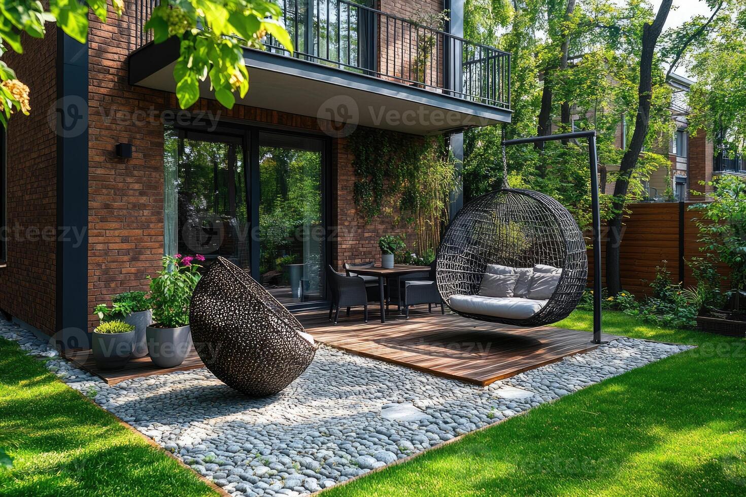 Modern backyard patio with hanging egg chair swinging gently photo