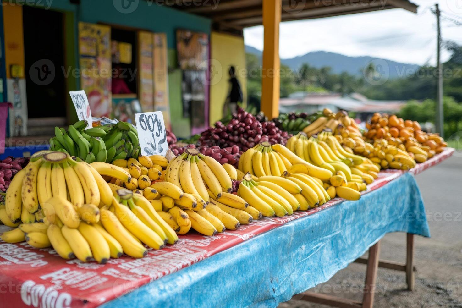 Fresh tropical fruits displayed on table at outdoor market photo