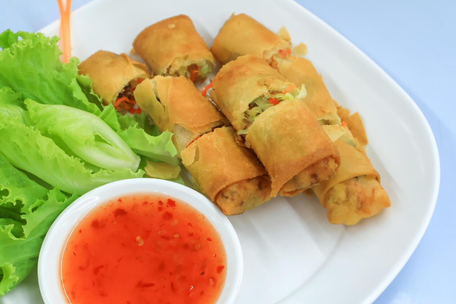 Top view of Fried spring rolls on dish. Vegetarian food photo