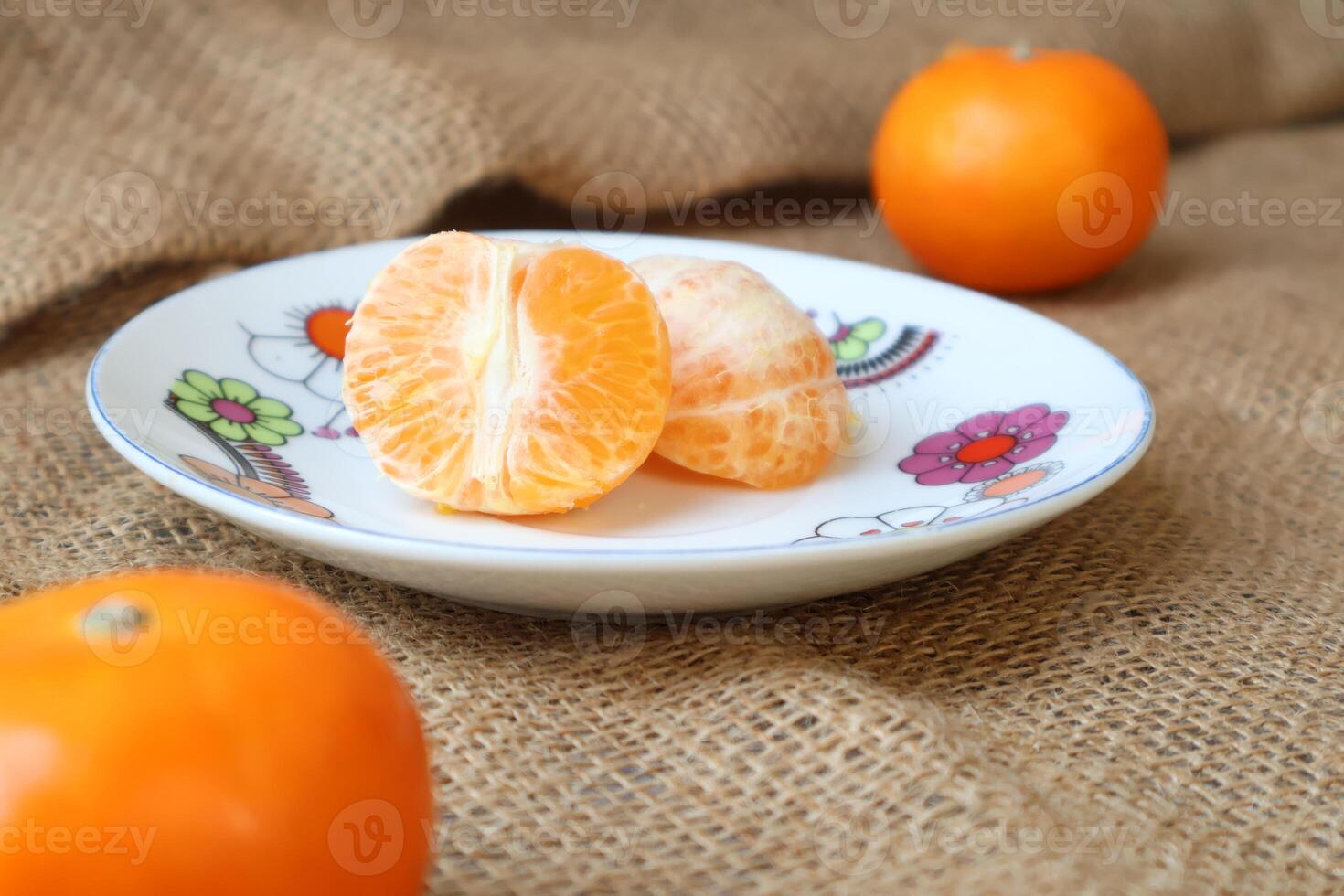 Side view of sliced fresh Oranges fruit on a plate. Wogan Orange. Fruits contain vitamins. citrus fruit photo