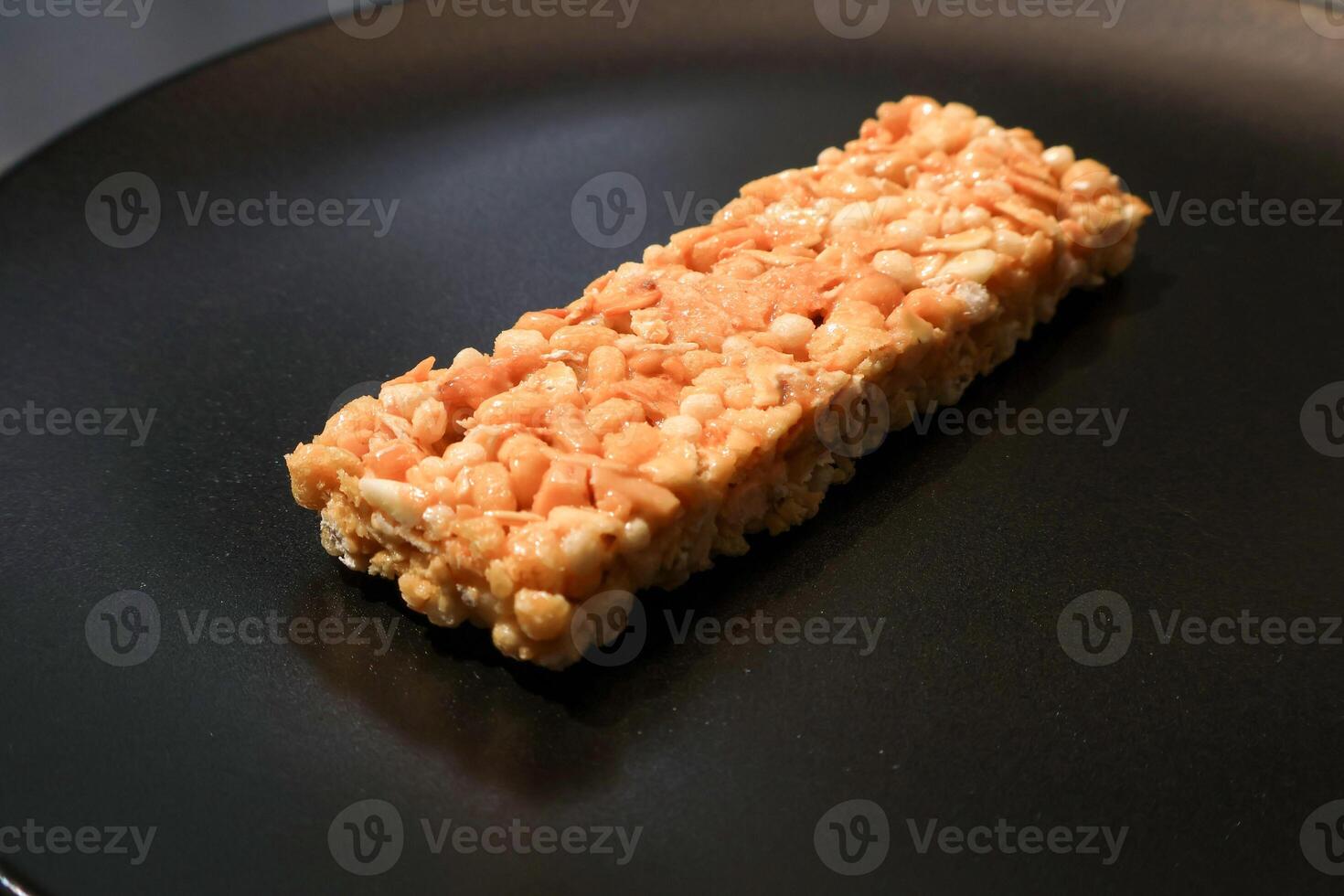 Side view of granola bar honey flavor. wellness concept. Closeup photo