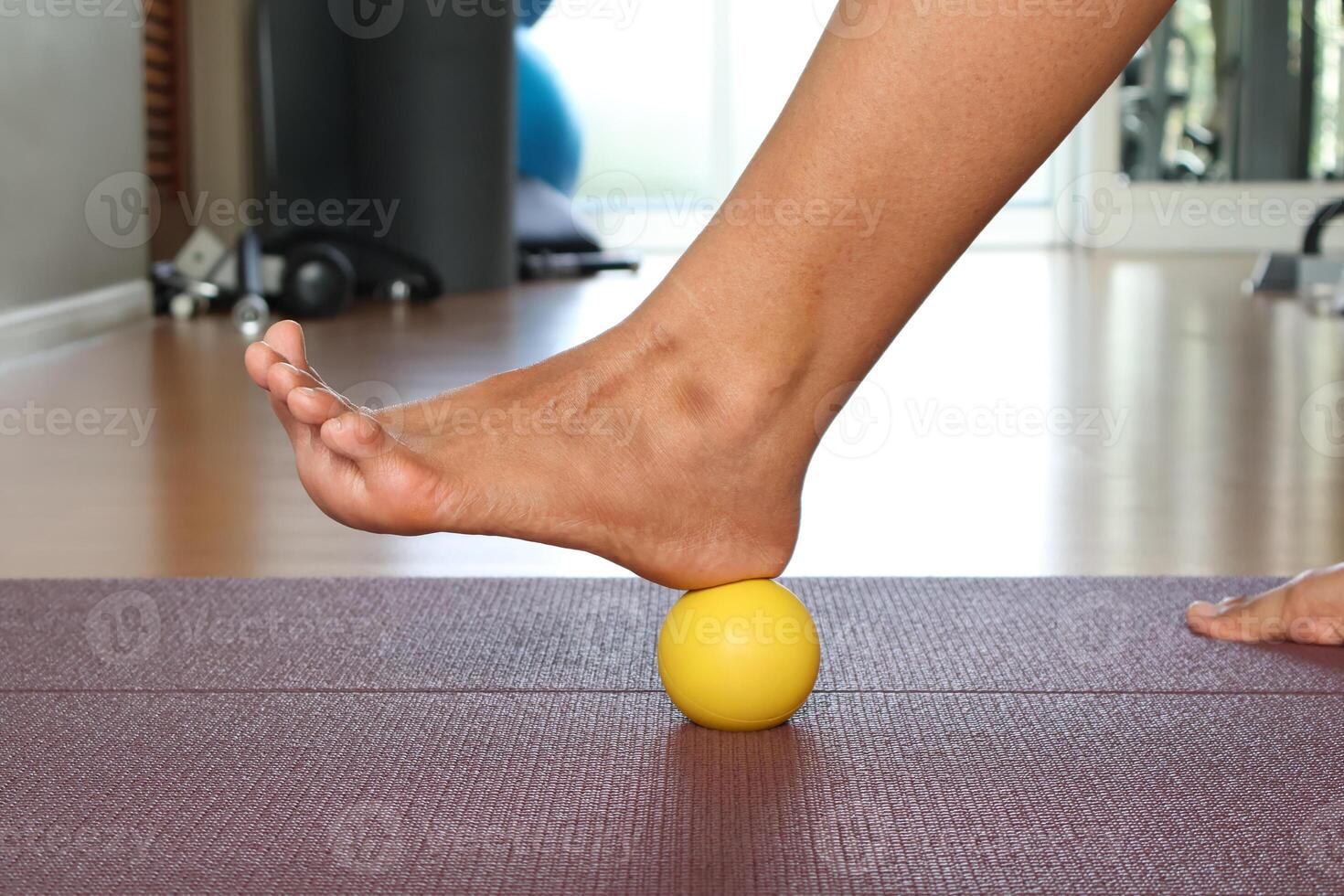 Use a foot massage ball to relieve heel pain. wellness concept photo