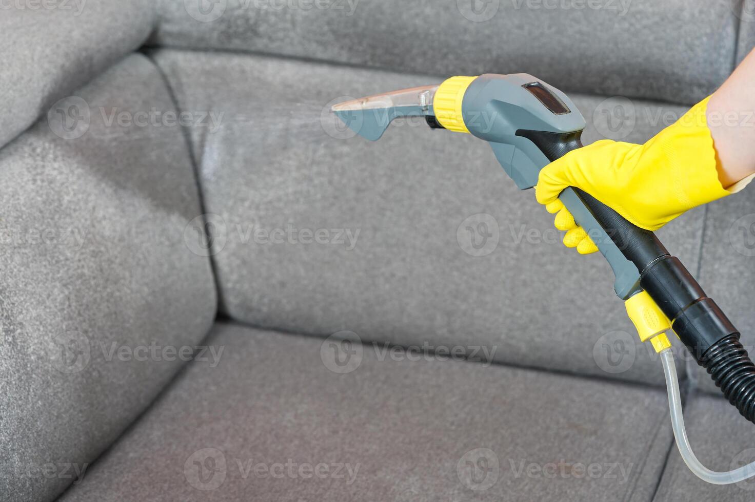 Textile sofa chemical cleaning with professionally extraction method. Upholstered furniture. domestic cleaning service. dust mite photo