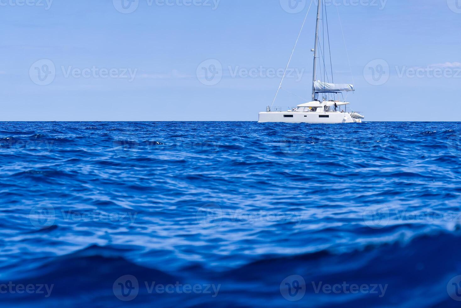 Yacht catamaran on the sea. Catamaran sailing on turquoise waters. Holiday or vacation at sea. Luxury yachts. summer photo