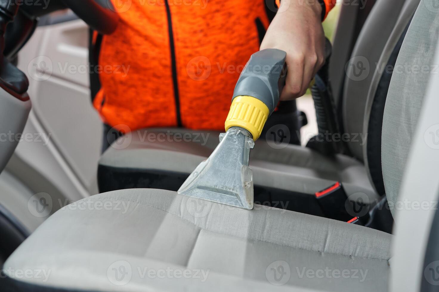 car dry cleaning. Light gray textile seats chemical cleaning with professionally extraction method. regular clean up photo