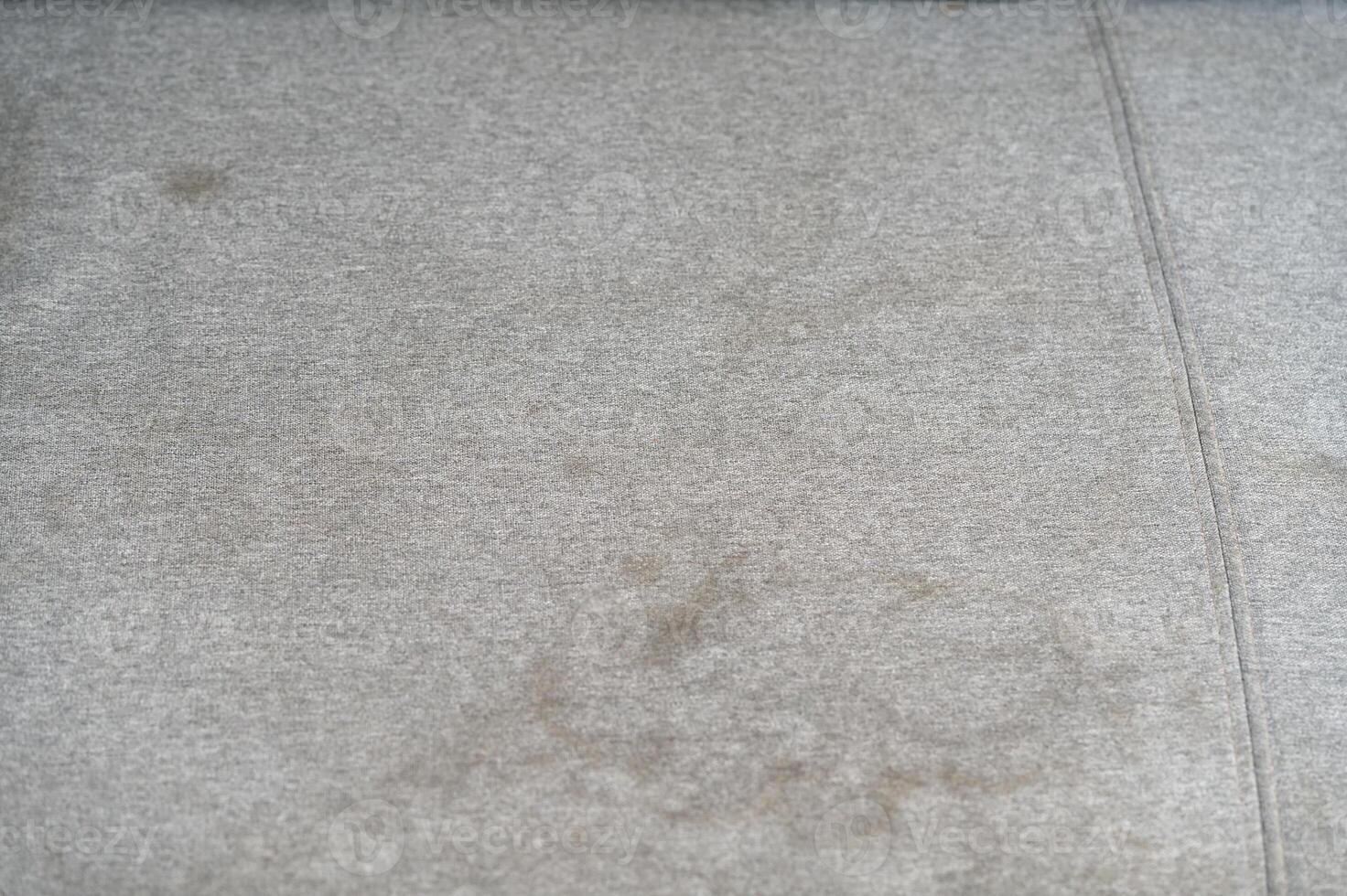 Dirty, stain, blot , fleck of water on the fabric, textile sofa. Dirty textile sofa chemical cleaning Dirty textile sofa chemical cleaning. upholstered furniture cleaning concept photo