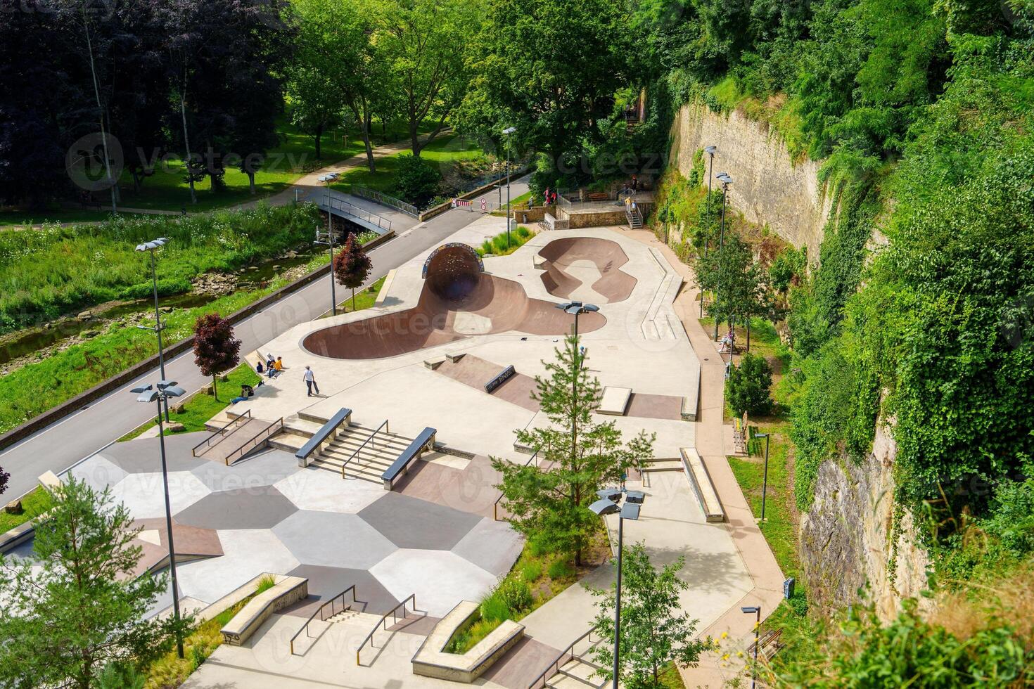 Colorful Skatepark in Luxembourg Park Near Fortress Wall for Skateboarding photo