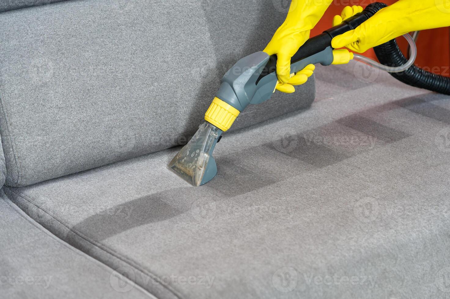 Sofa before and after wet - cleaning indoors. textile sofa vacuum cleaning. professional cleaning service concept. photo