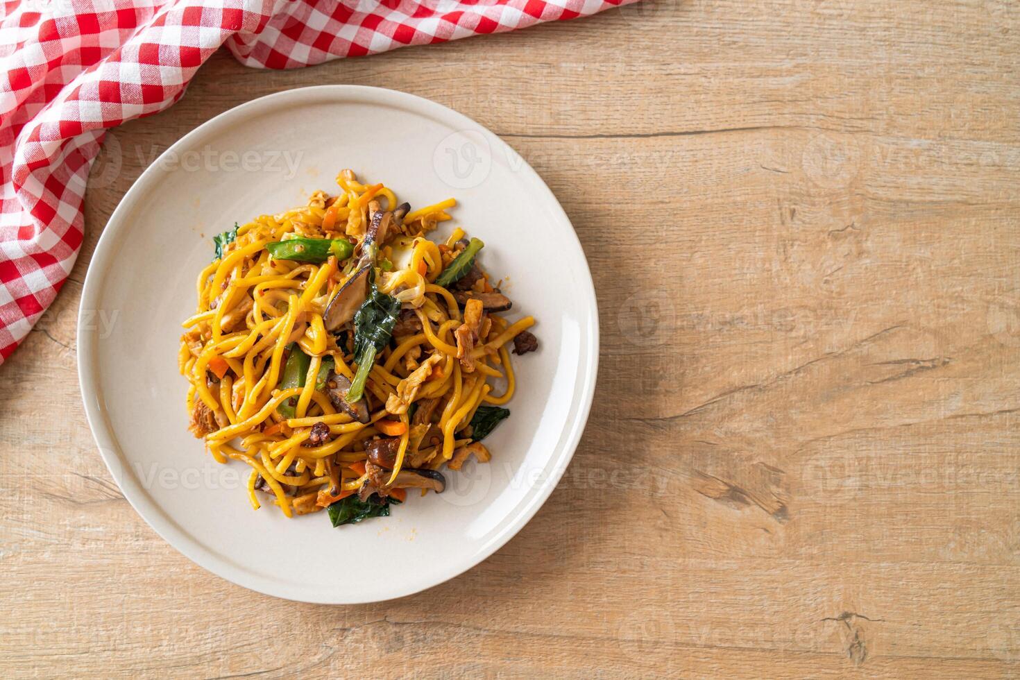 stir-fried yakisoba noodles with vegetable in vegan style on plate photo