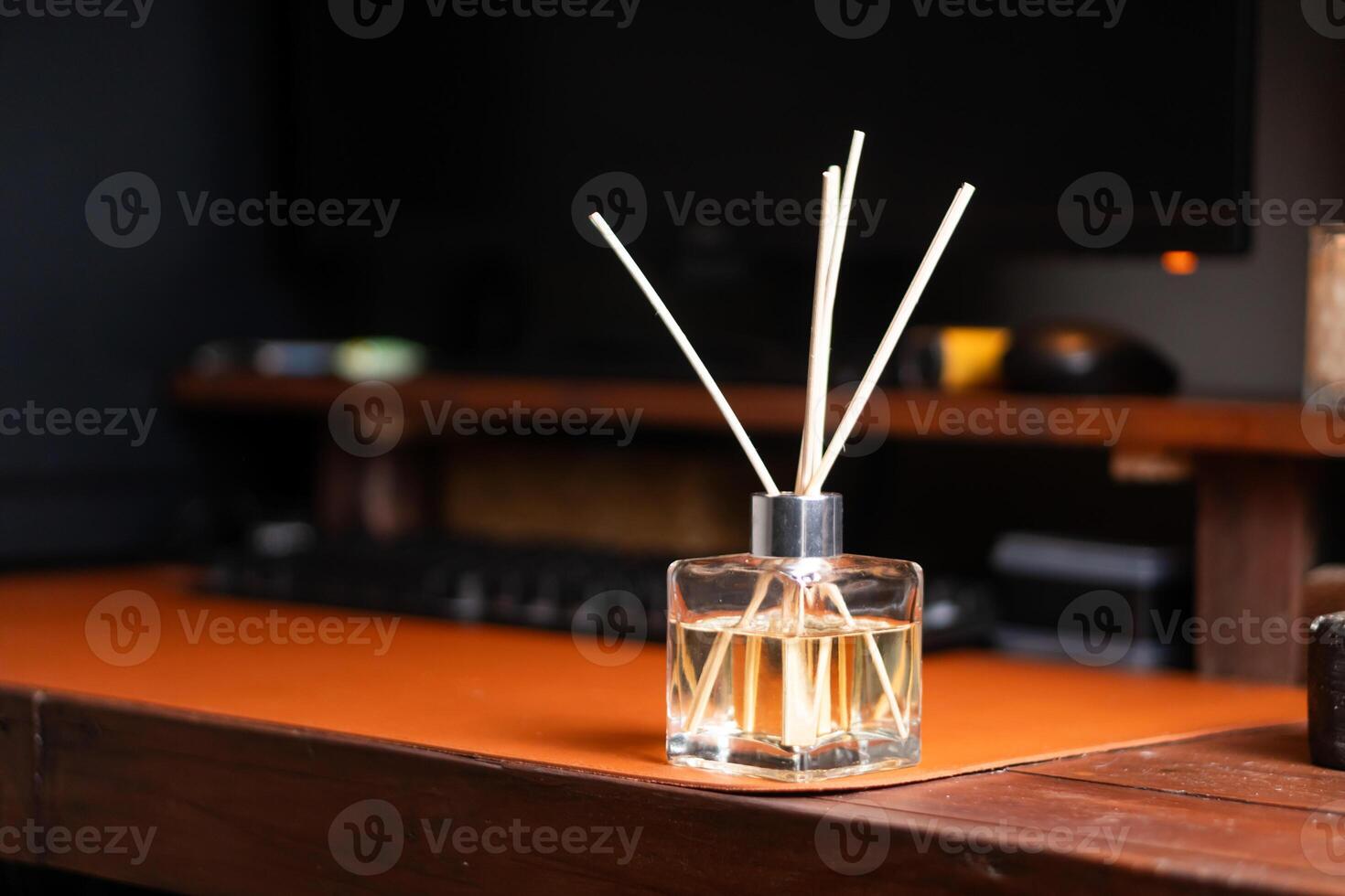 Stylish Glass Diffuser on a Wooden Desk photo