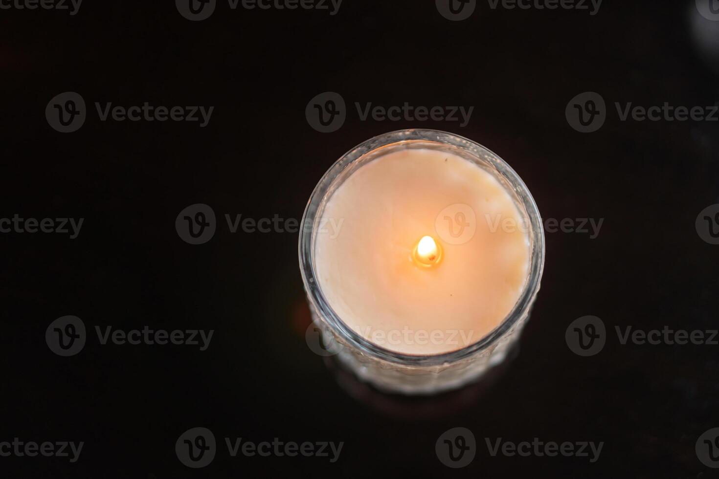 Lit Candle in Glass Jar photo