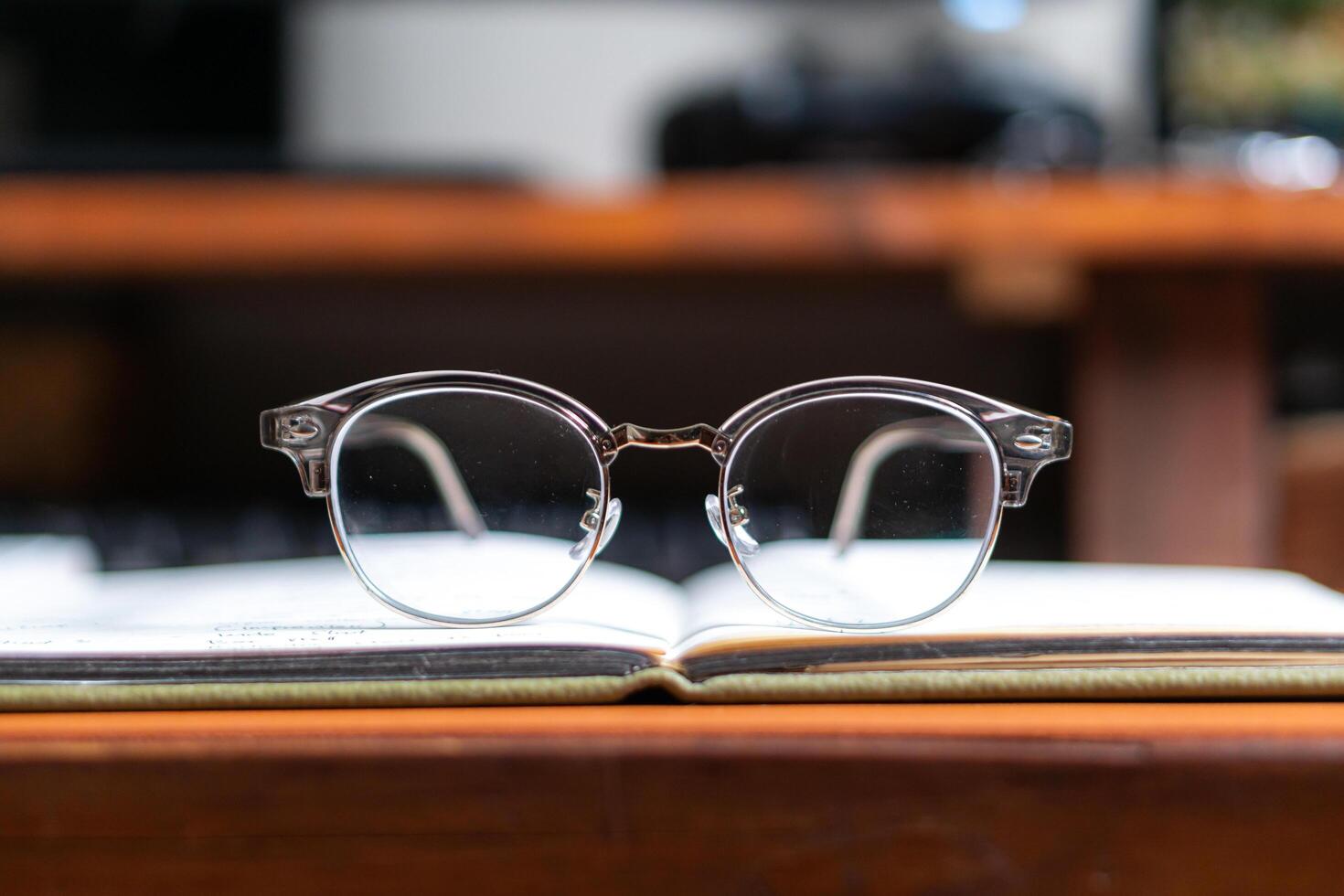 A pair of glasses on a book photo