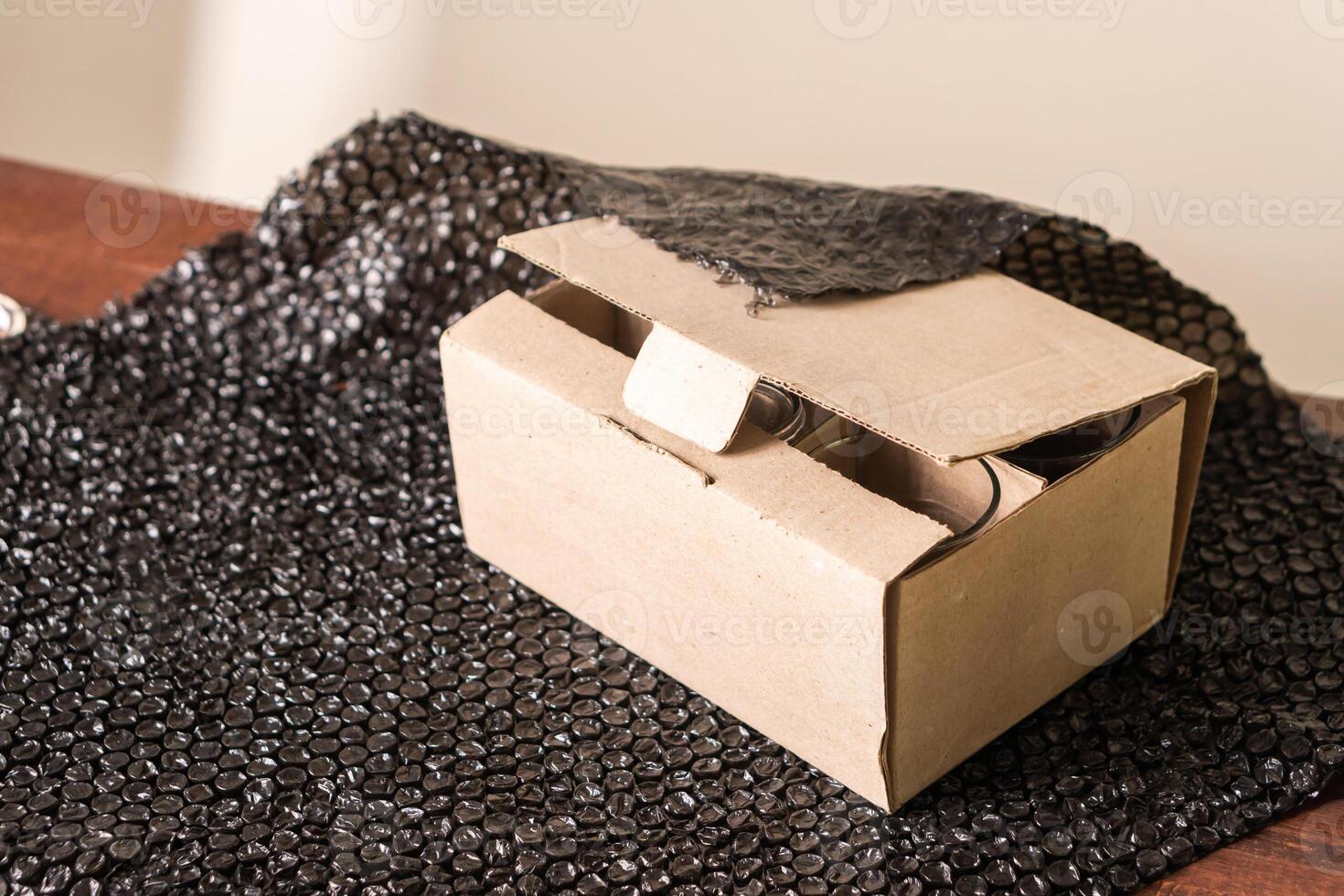 Partially Opened Cardboard Box on Black Surface photo