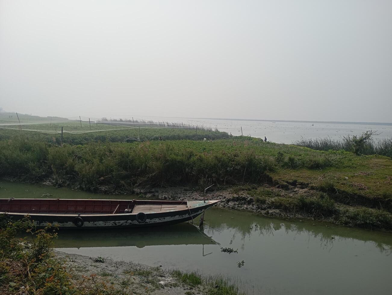 a boat is docked in the water photo