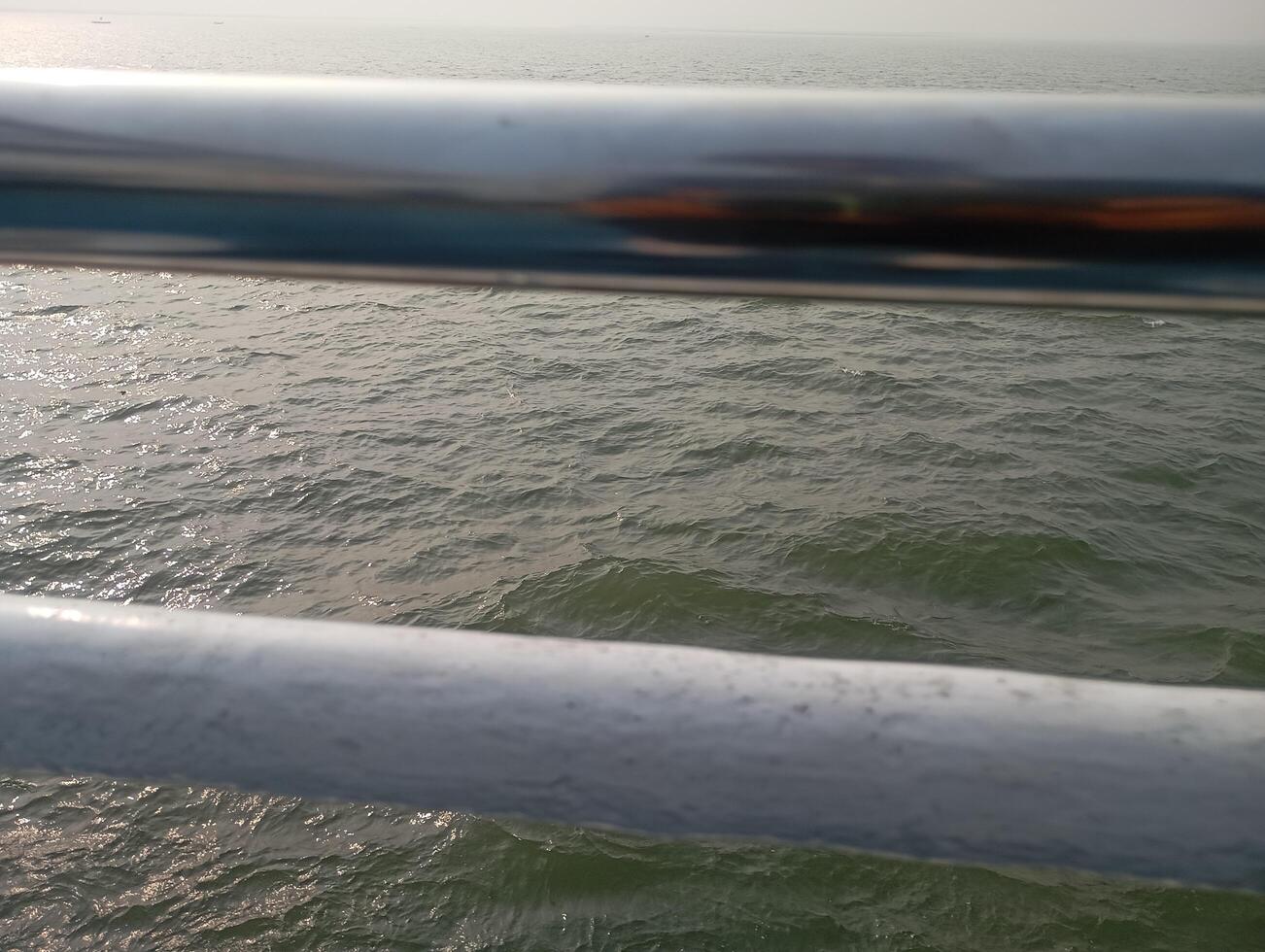 a view of the ocean from a bridge photo