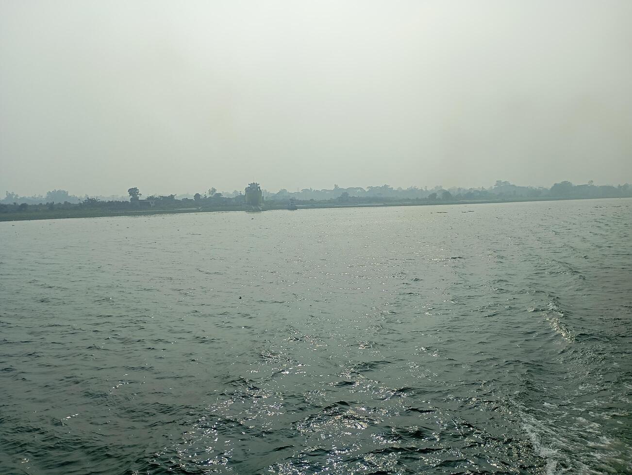 a view of the water from the back of a boat photo