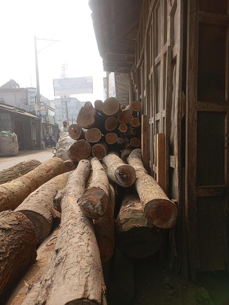 a pile of logs on the street photo