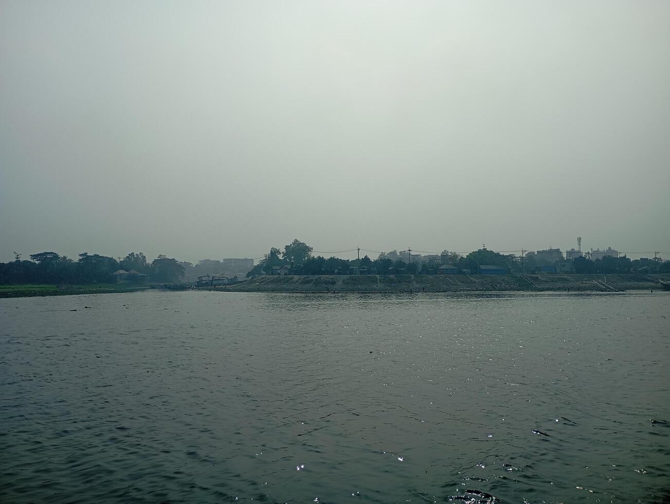 A body of water with a few boats on it photo