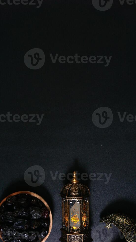 A Plate of Dates With Islamic Lanterns on Black Background photo