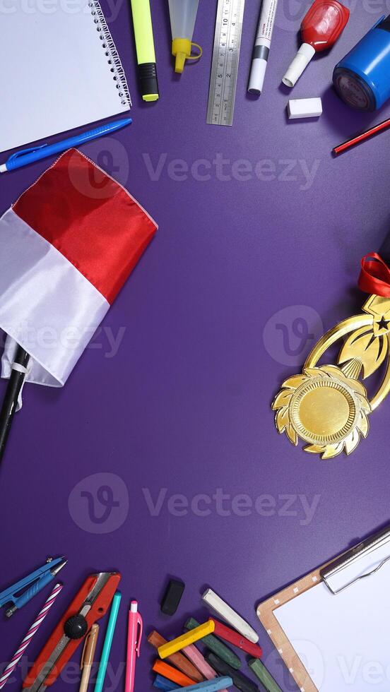 School Stationery with Notebook and Wooden Board Isolated on Purple Background and Copy Space. Back to School Concept photo