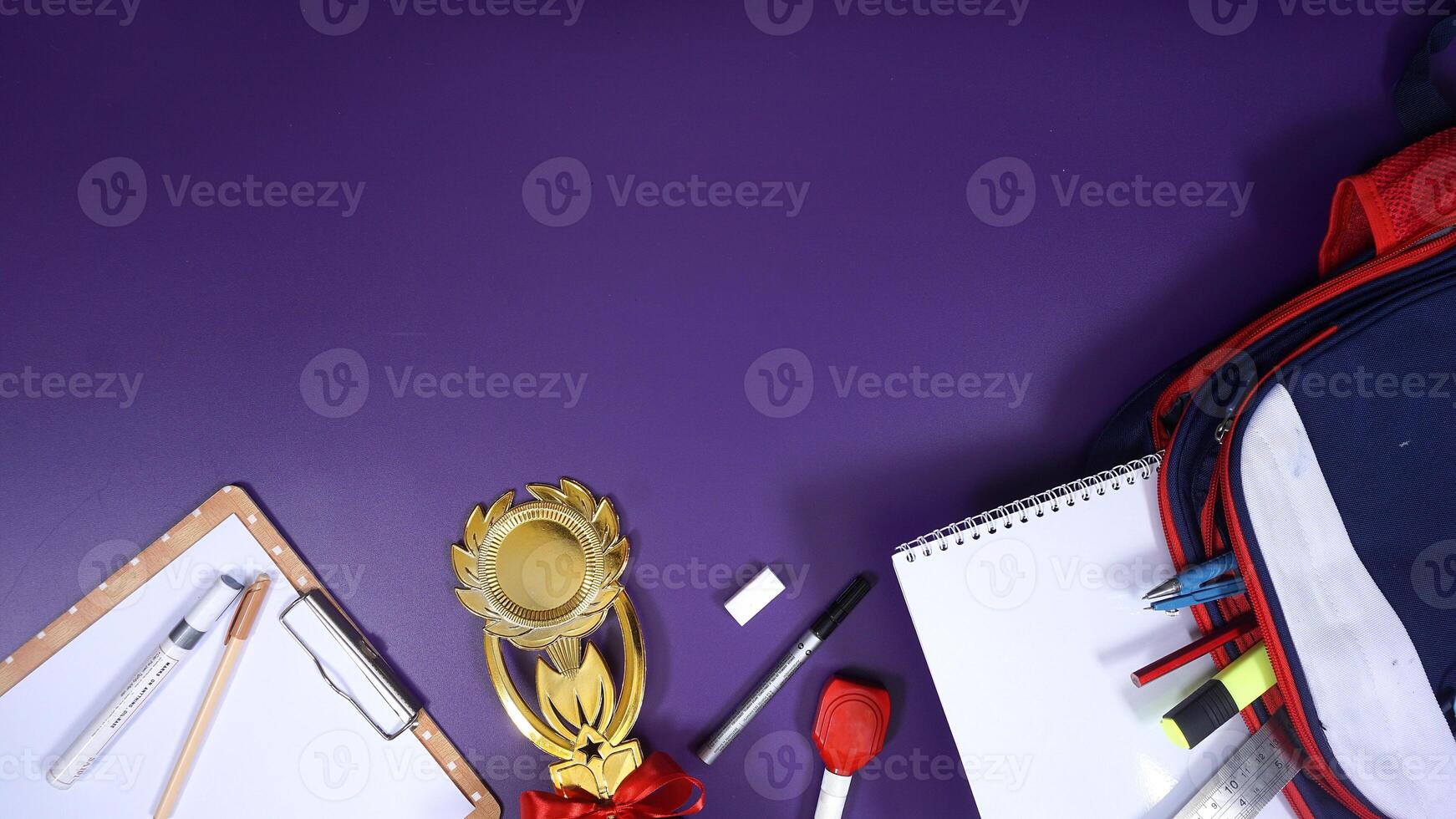 School Stationery with Backpack and Wooden Board Isolated on Purple Background with Blank Area for Copy Space. Back to School Concept photo