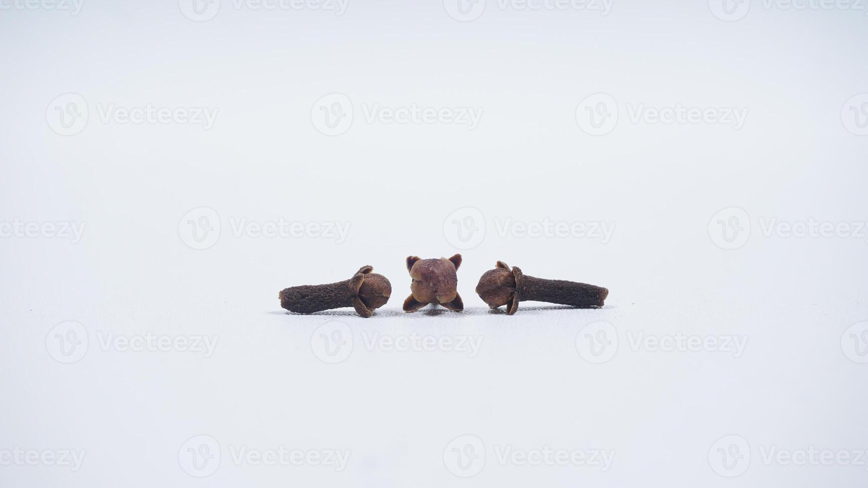 Three Cloves Isolated on White Background photo