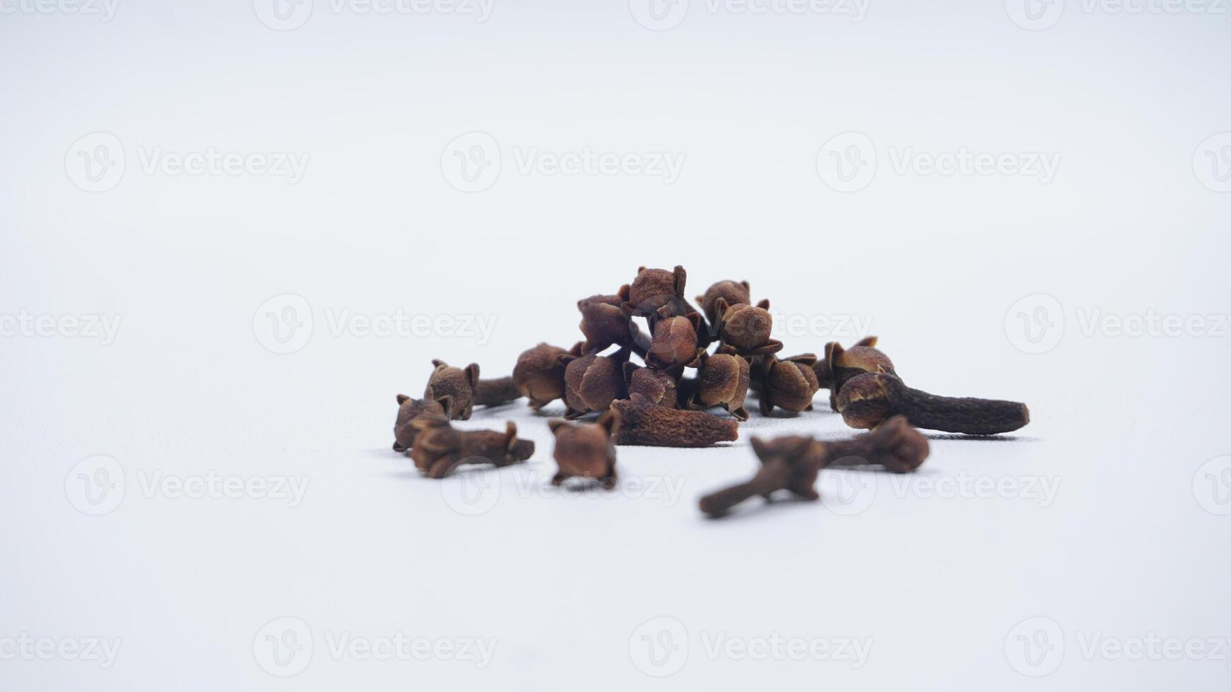 Pile of Cloves Spice with Selective Focus Isolated on White Background photo