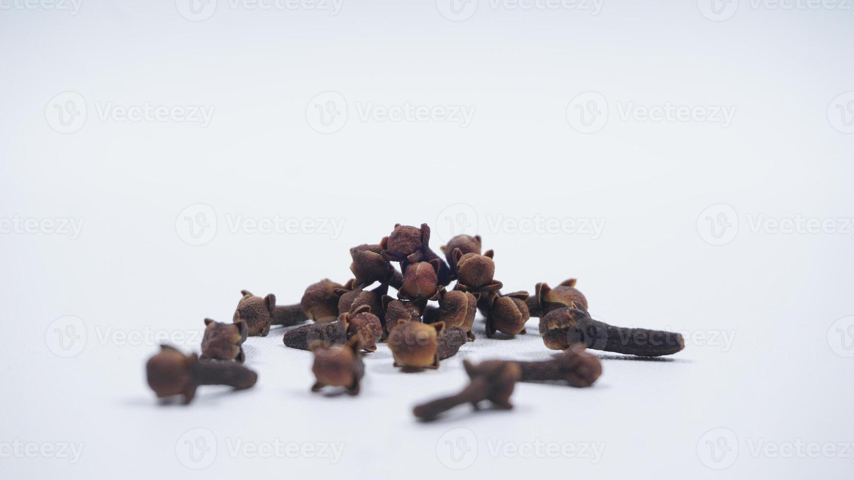 Scattered Cloves Isolated on White Background photo