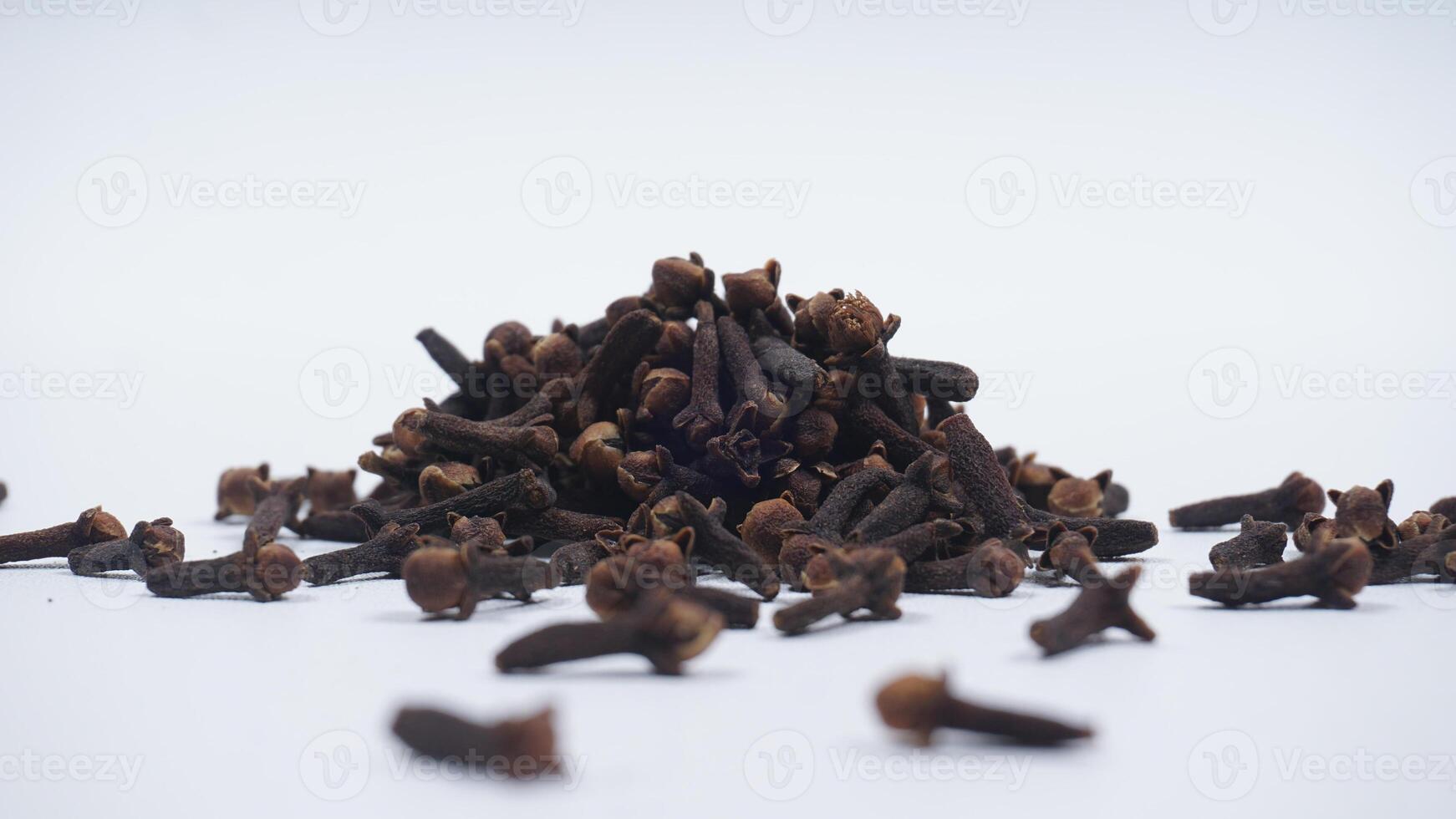 Pile of Dried Cloves Spice Isolated on White Background photo