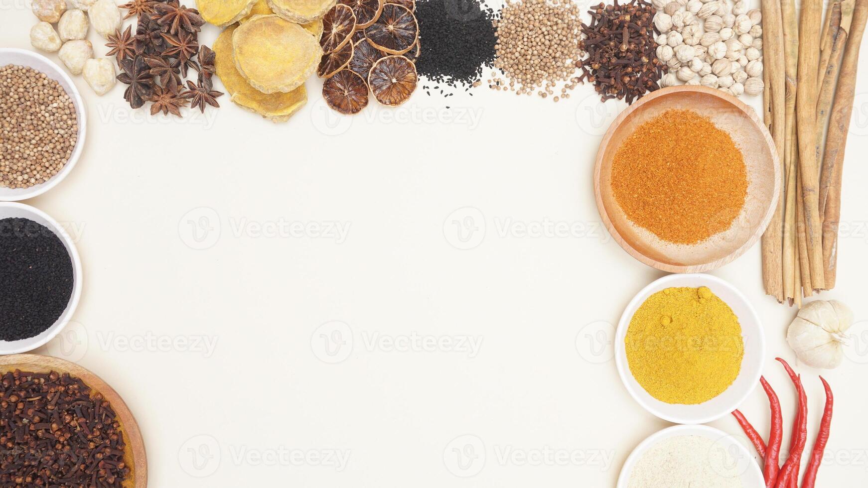 Various Spices and Spice Powders with Copy Space Area on Light Background photo