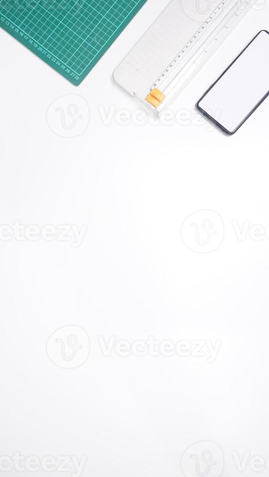 Office Supplies with Mobile Phone on White Background photo