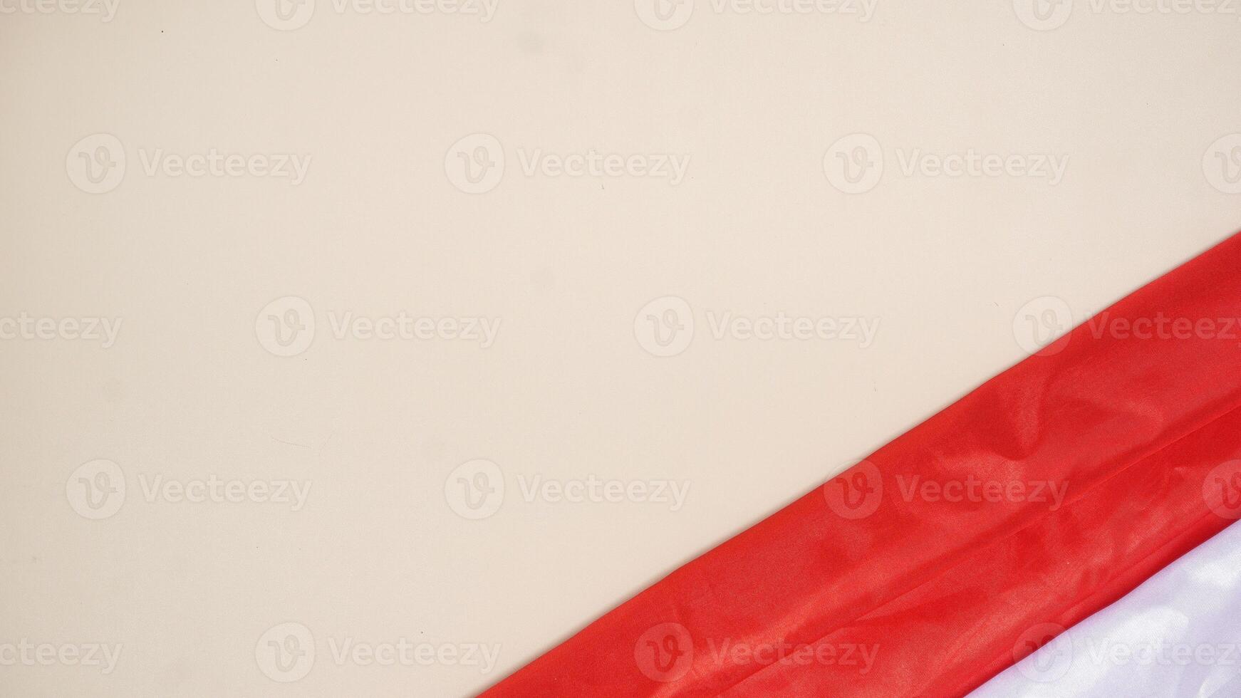 Indonesia Red and White Flag with Copy Space Area on Light Background photo