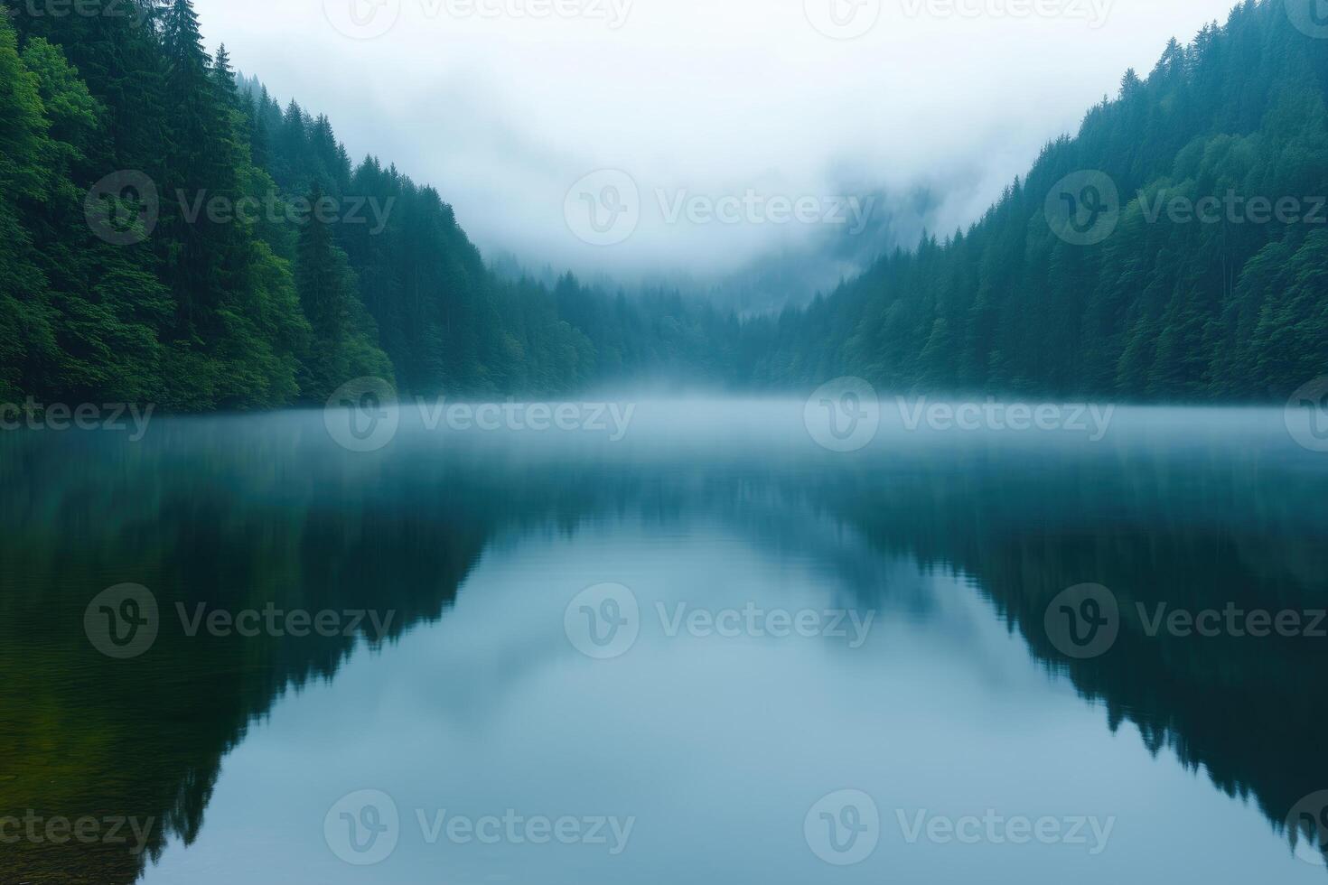 Misty morning at the lake in the mountains photo