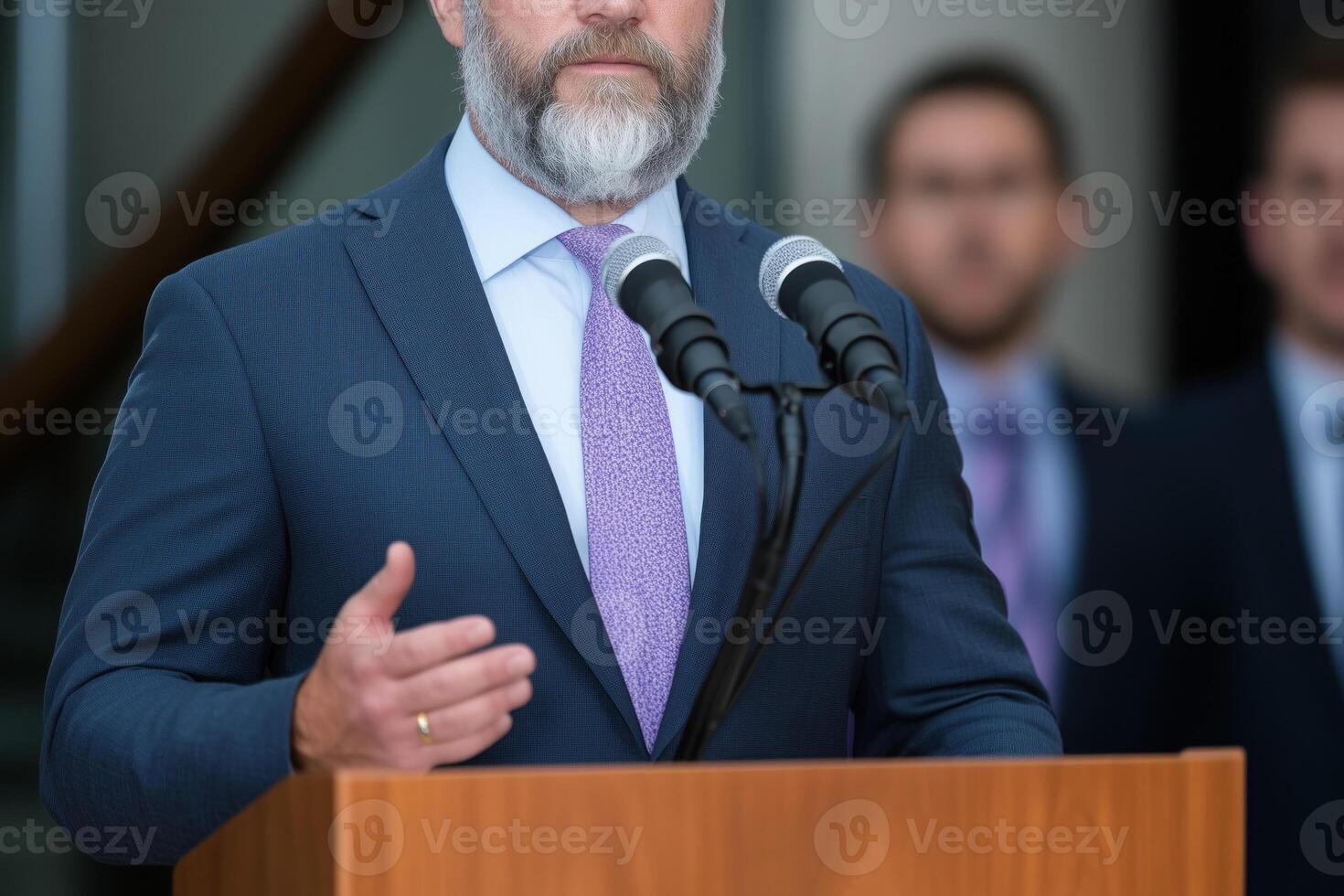 close up of senior man giving speech from a podium photo