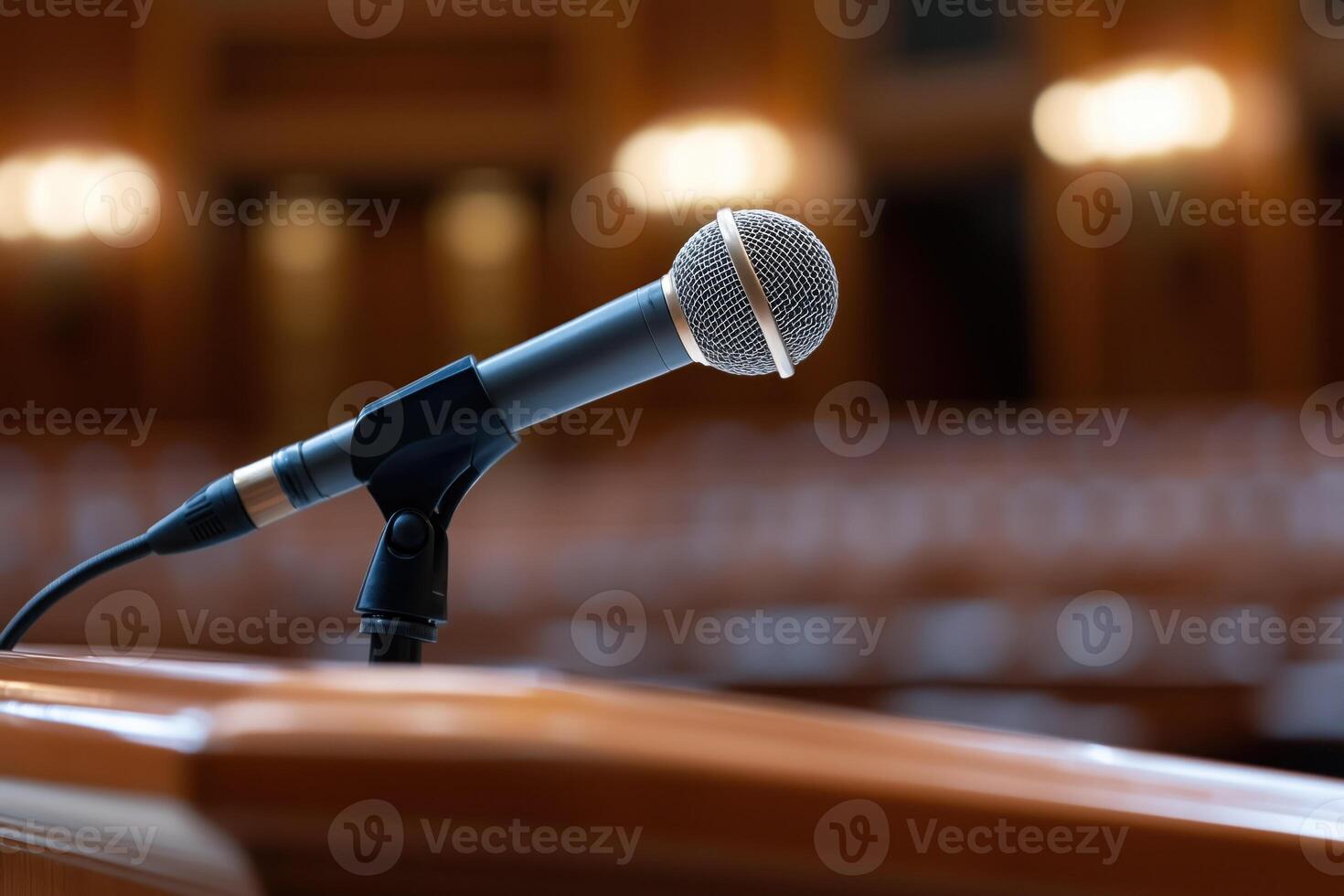 Microphone on the stand in the conference hall, close-up photo