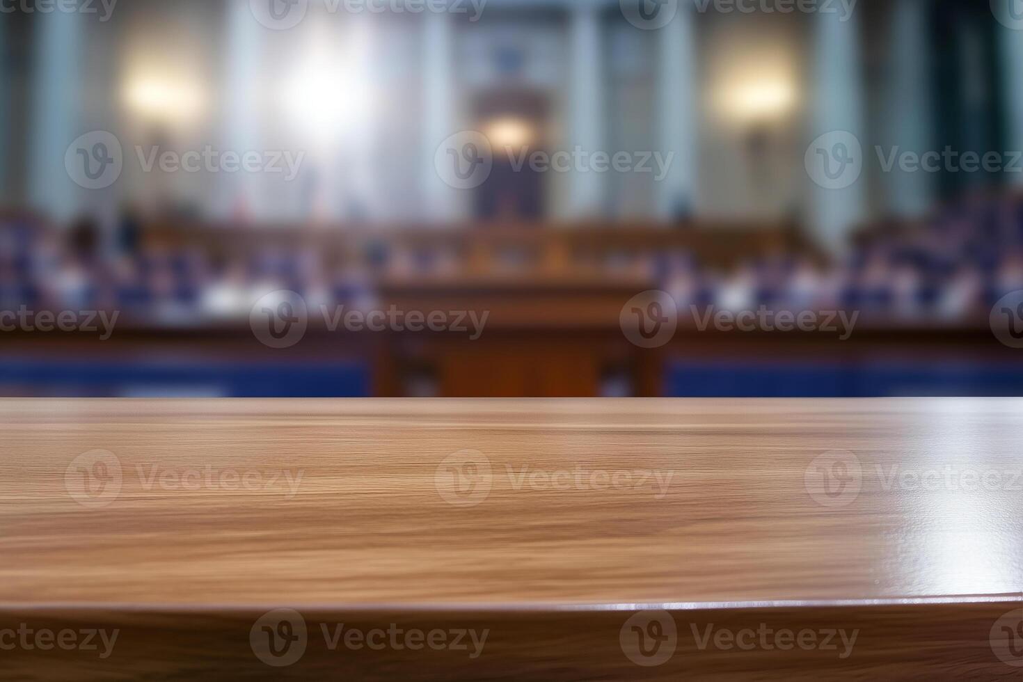 Empty wooden table and blurred background of conference hall or seminar room. photo