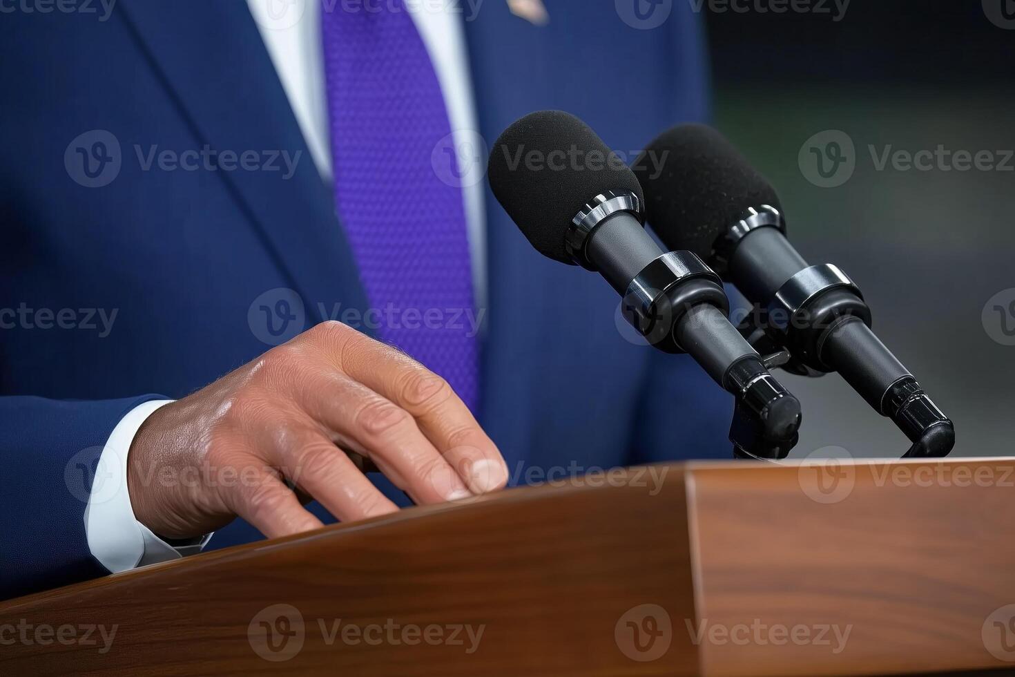 Close-up of politician giving speech at conference hall or meeting room photo