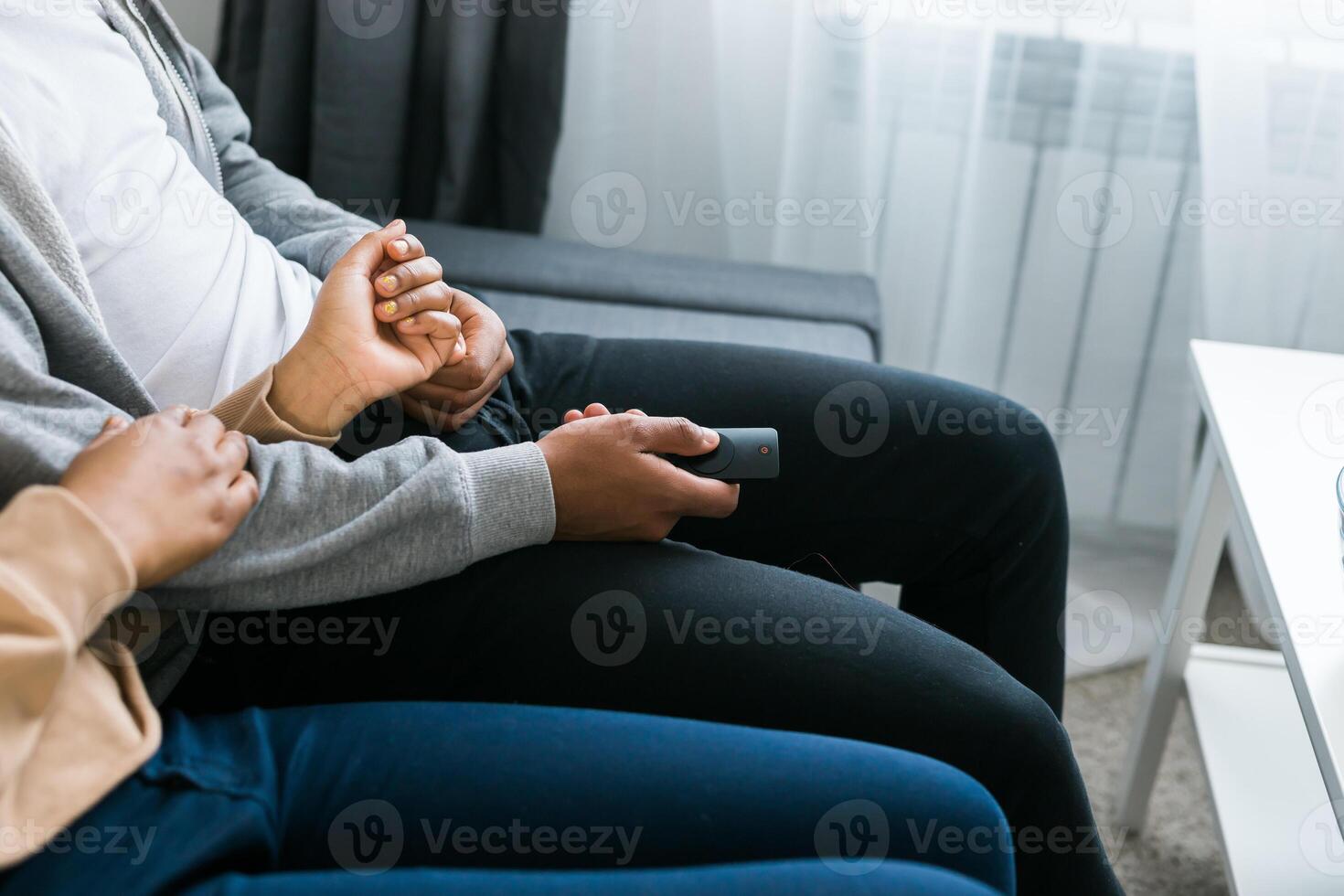 Remote control is pointed toward the television screen, control and choice of tv entertainment. TV, series and streaming service concept photo