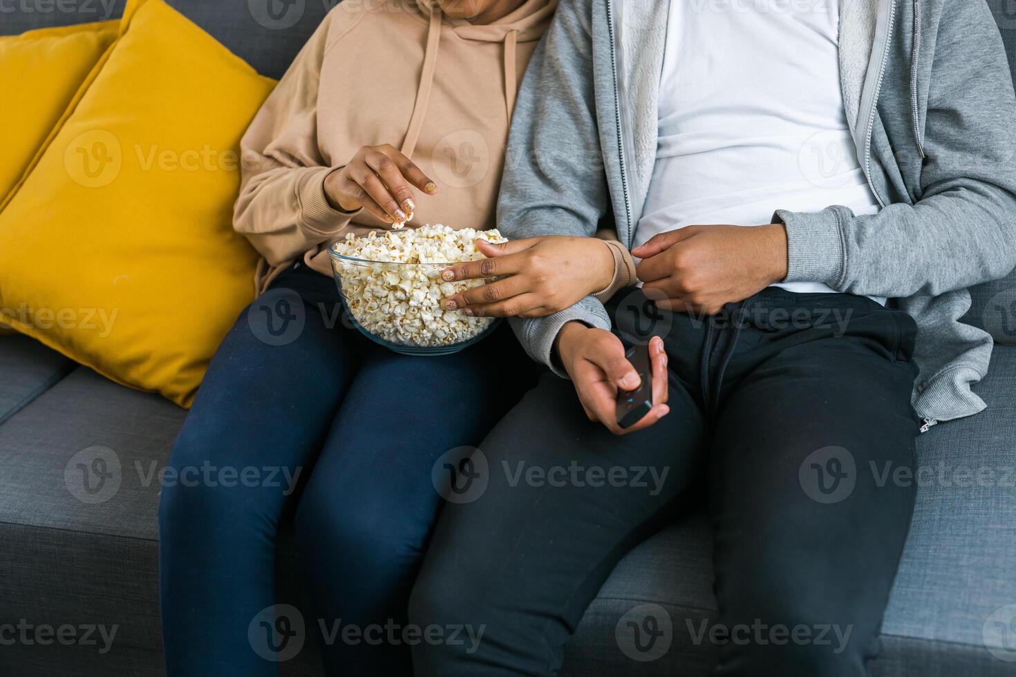 Remote control is pointed toward the television screen, control and choice of tv entertainment. TV, series and streaming service concept photo