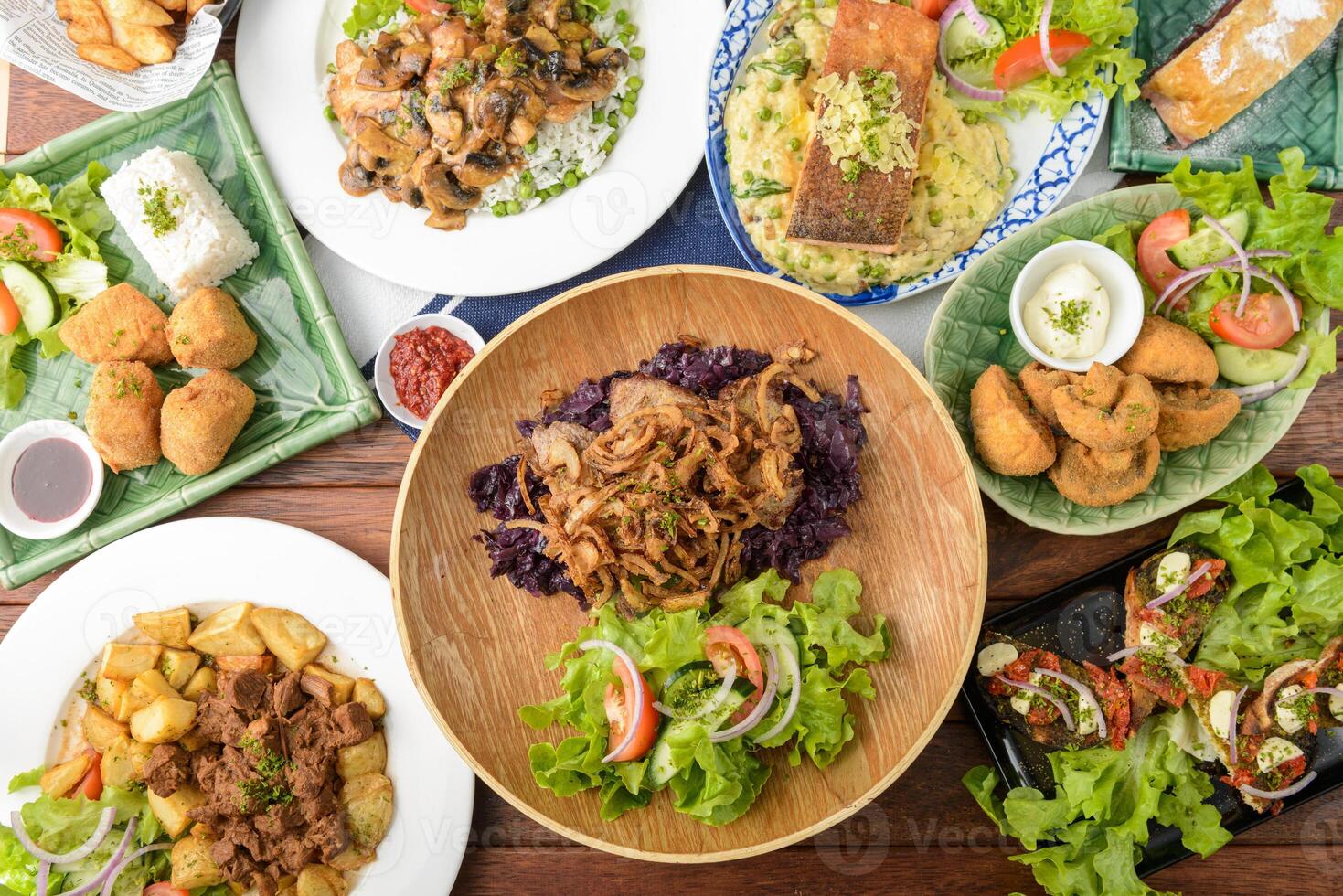 A table with many plates of food on it photo