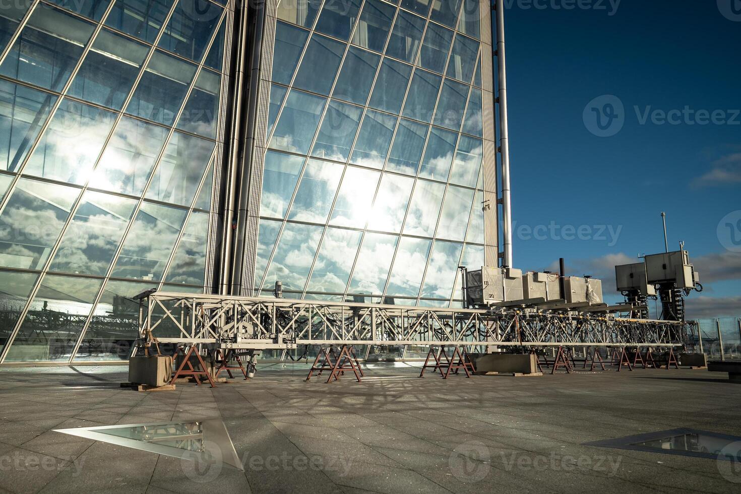 Facade cleaning device for skyscraper glass walls. Automated window washing, glass surface care photo