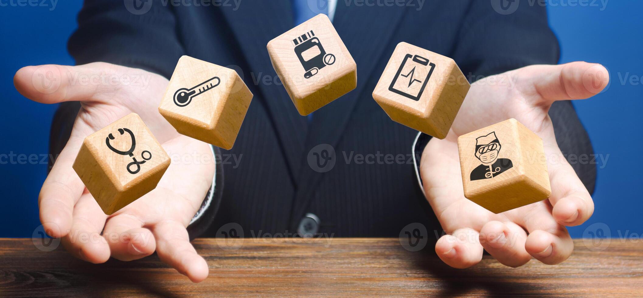 Man throwing blocks with medicine images. Provision of medical services supplies in pandemic. First aid equipment. Dispatch of humanitarian aid and specialists to stop coronavirus COVID-19 spreading photo