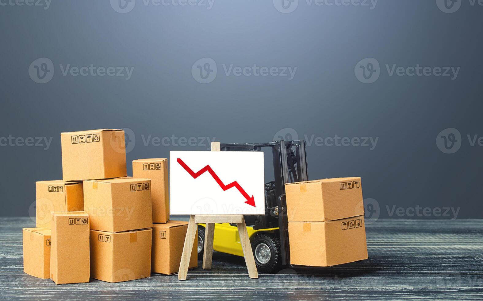 Forklift near boxes and easel with red arrow down. Decline trade and production rates, decreased sales. Low import export. Economic reduced, industry degradation. Marketing, price reduction. photo