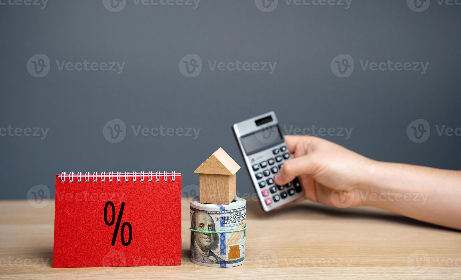 Mortgage or home loan interest rate concept. Taxes rates of housing. Real estate market analysis. Business and Finance. Notes with percent sign, money and calculator. photo